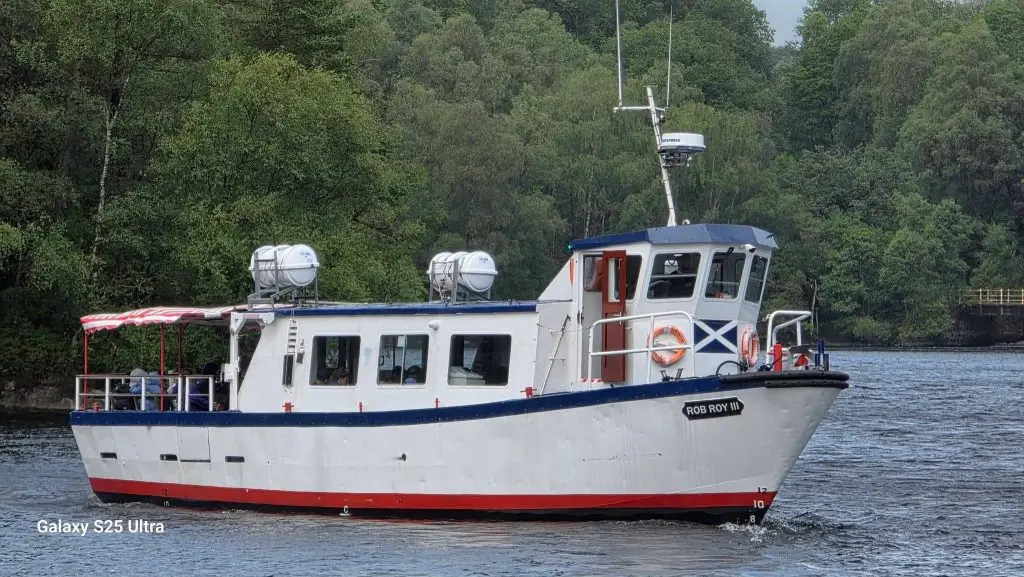 Hunters Executive Coaches vehicle at Loch Katrine in the Trossachs